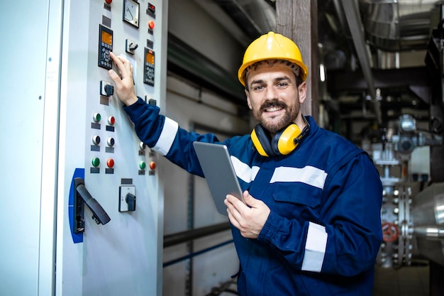 Portrait of electrician with digital tablet checking installations and power supply