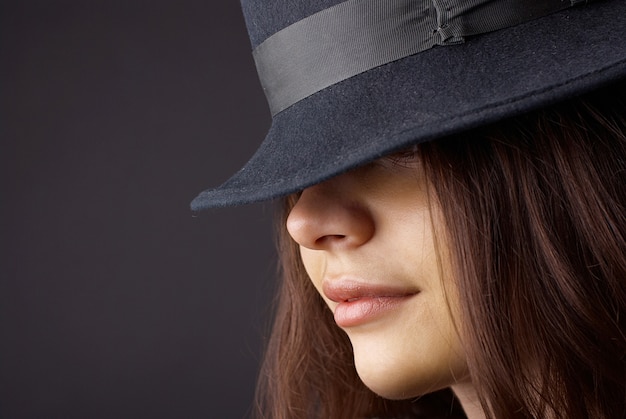 Portrait of elegant fashionable woman in hat