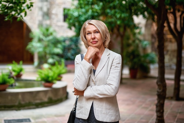 Portrait of elegant mature woman outdoors