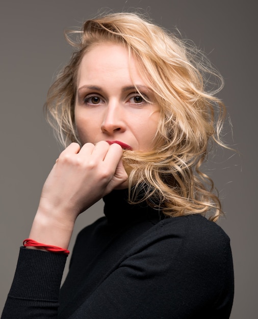 Portrait of elegant woman isolated on grey