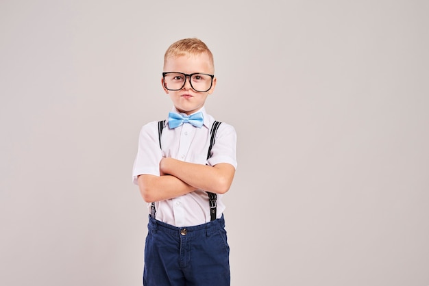 Portrait of elementary student with arms crossed