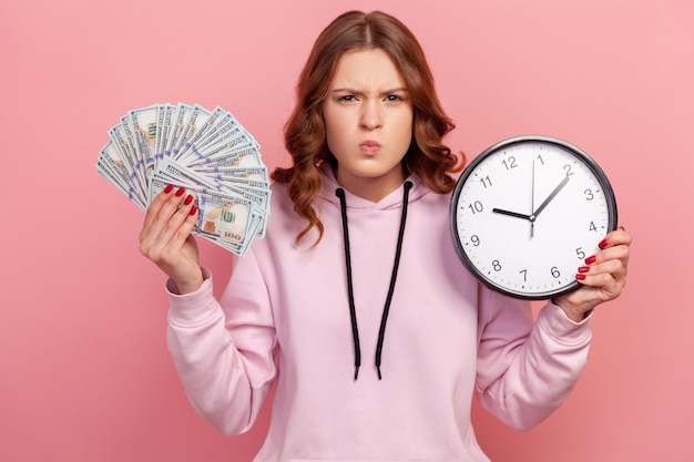 Portrait of emotional young girl on pink background