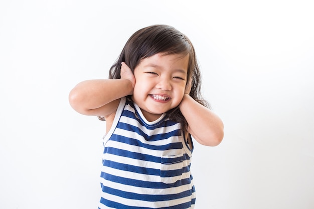 Portrait of emotionally kid. Funny little girl isolated on white background