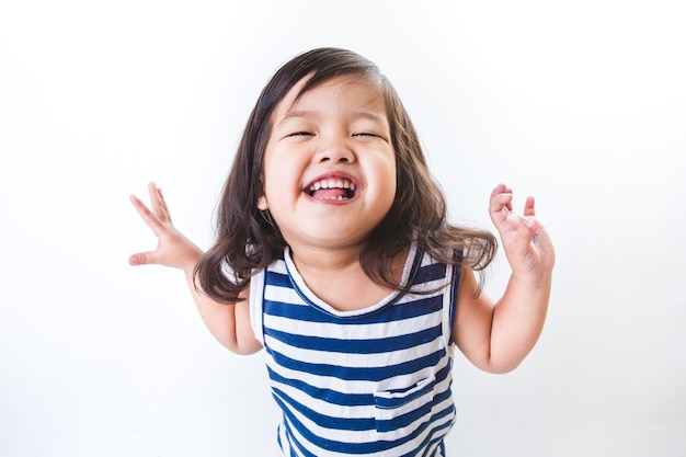 Photo portrait of emotionally kid. funny little girl isolated on white background