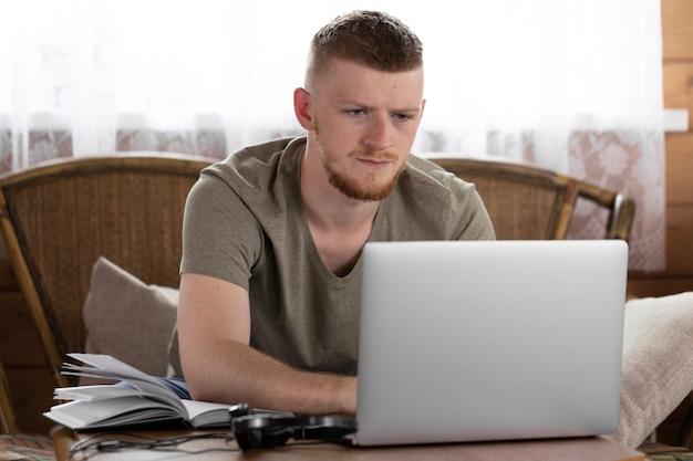 Portrait of a employee working remotely from home using laptop