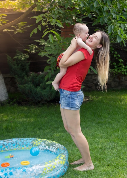 Portrait of energetic cute toddler with mother