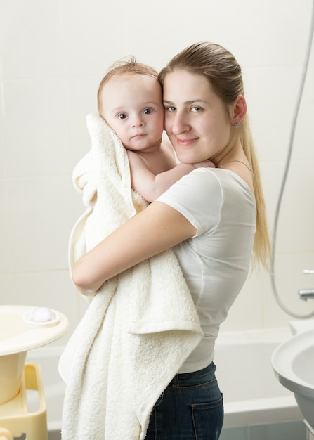 Portrait of energetic cute toddler with mother