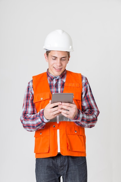 Portrait of engineer working with tablet for work.