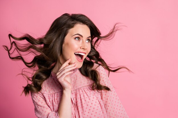 Portrait of enthusiastic candid dreamy girl hairstyle wind blow look copyspace