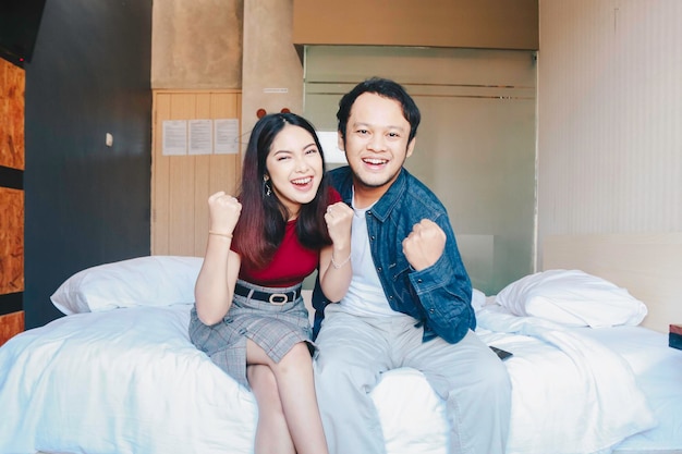 A portrait of an enthusiastic success Asian couple