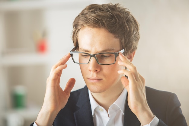 Portrait of european guy at workplace