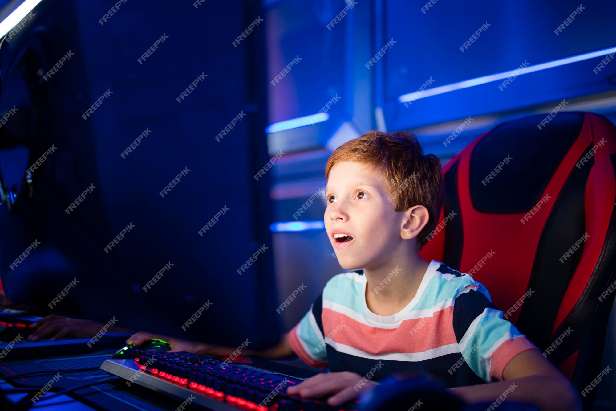 Boy play game on gaming PC online Stock Photo - Alamy