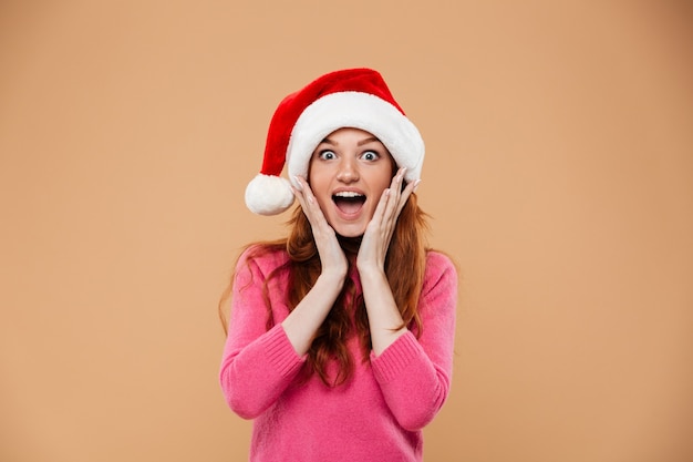 Portrait of an excited happy redhead girl