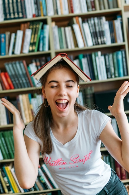 Portrait of an excited happy student girl