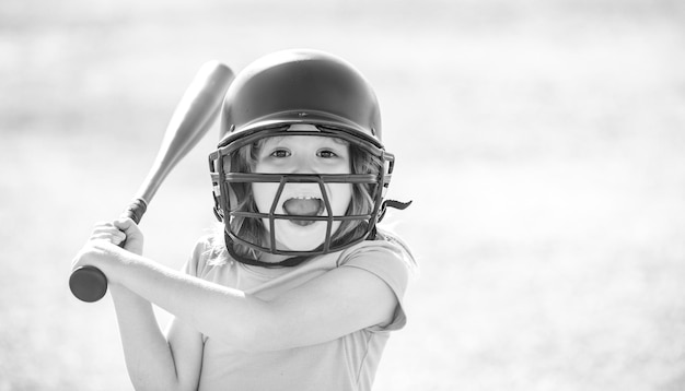 Portrait of excited kid baseball player wearing helmet and hold baseball bat