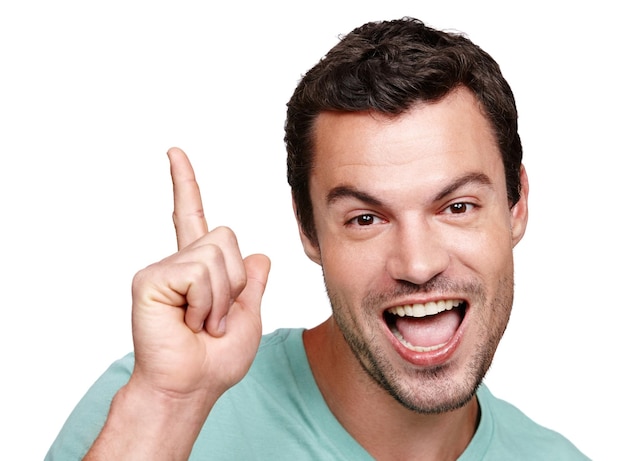 Portrait excited and mockup with a man in studio isolated on a white background for marketing or advertising Face pointing and mock up with a happy male posing on blank product placement space