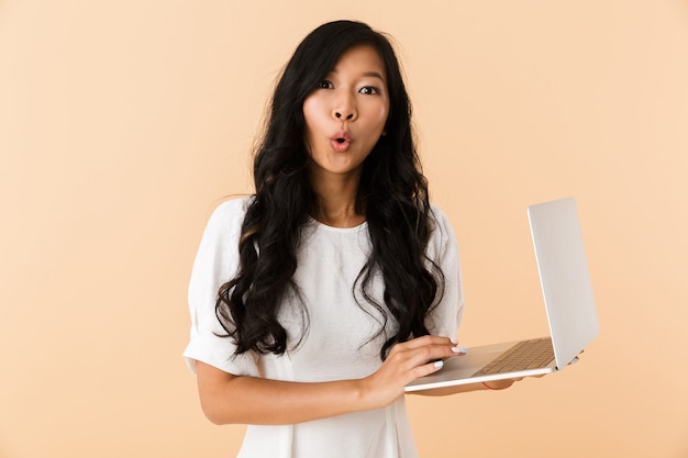 Portrait of an excited young asian woman