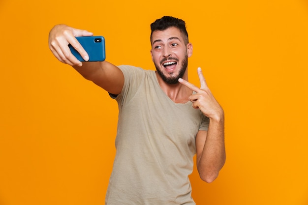 Portrait of an excited young bearded man