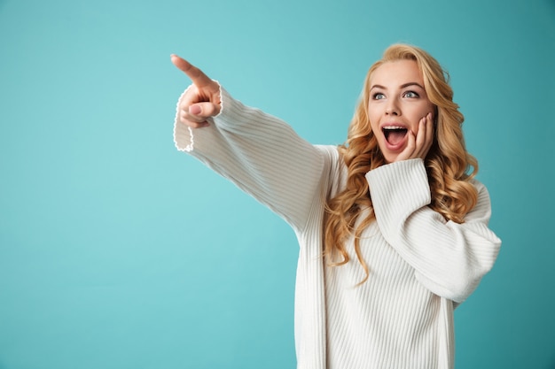 Portrait of an excited young blonde woman