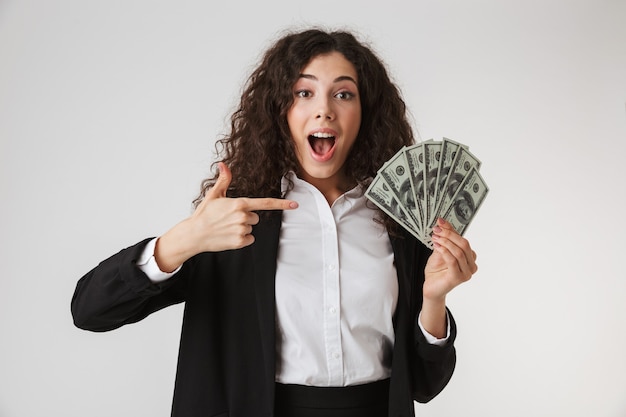 Portrait of an excited young businesswoman