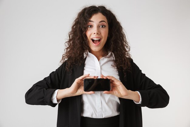 Portrait of an excited young businesswoman