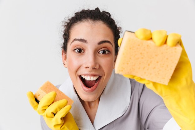 Portrait of an excited young housemaid