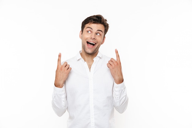 Portrait of an excited young man in shirt