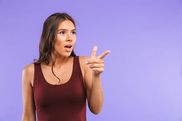 Portrait of an excited young woman standing