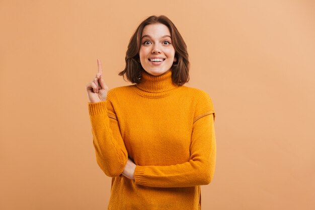 Portrait of an excited young woman in sweater