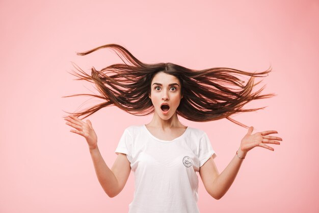 Portrait of an excited young woman with long hair