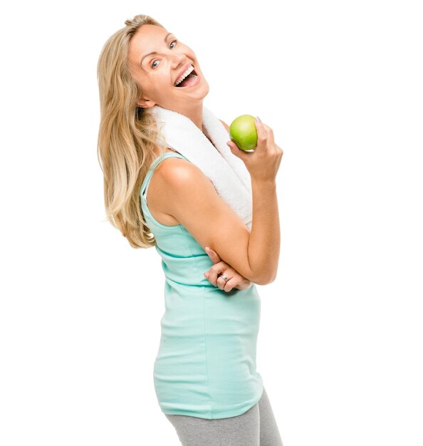 Photo portrait exercise and apple with a senior woman laughing in studio isolated on a white background fitness health or weightloss with a happy mature female athlete holding fruit for a nutrition diet