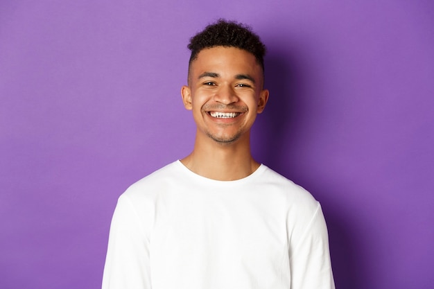 Portrait expressive young african man wearing white shirt