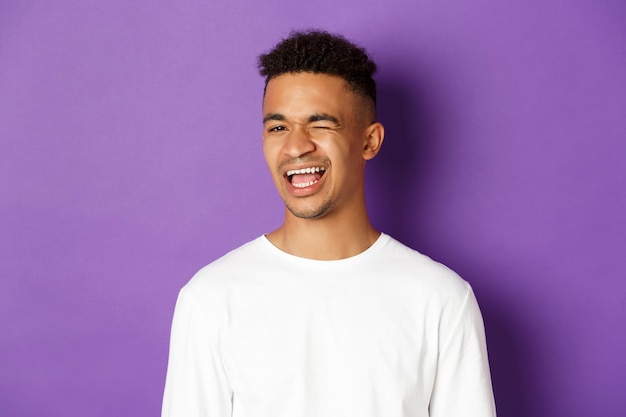 portrait expressive young african man wearing white shirt