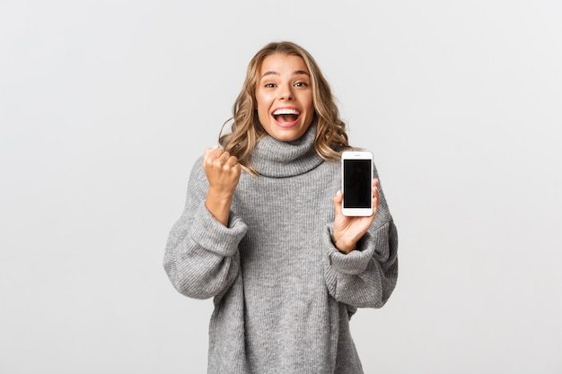 Portrait expressive young woman with mobile