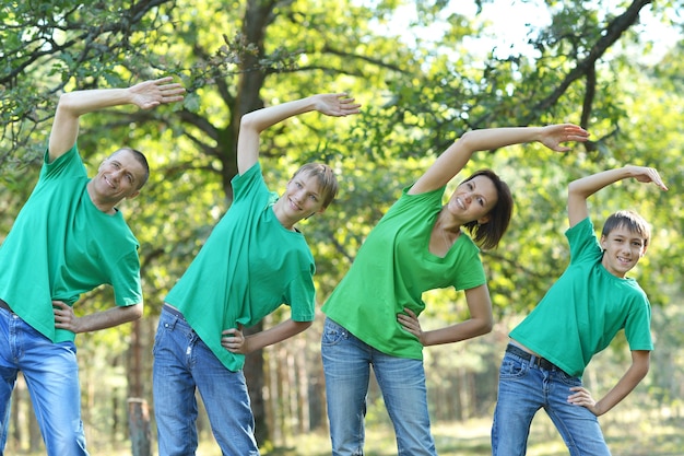 Portrait of a family doing exercises in summer