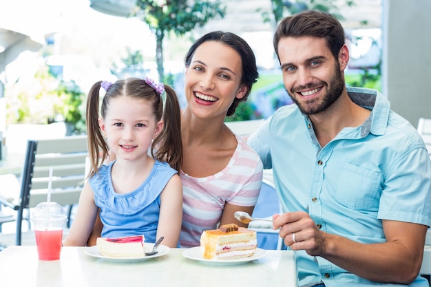 Portrait of a family eating at the restaurant