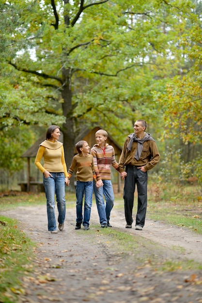 Portrait of family of four in park