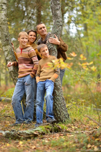 Portrait of family of four in park