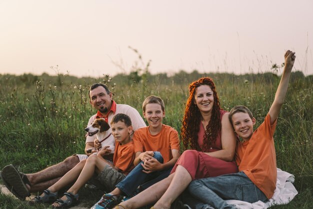 Portrait of a family in nature Children and parents play in nature Good time with family on vacation Happy family day