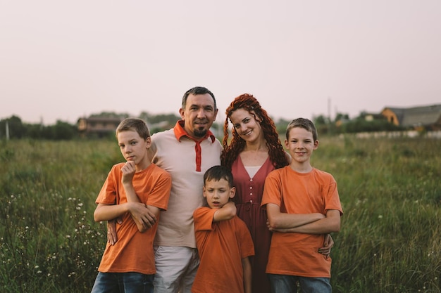 Portrait of a family in nature Children and parents play in nature Good time with family on vacation Happy family day