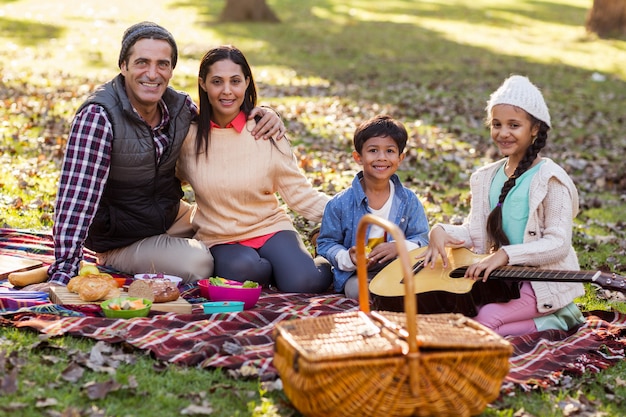 Portrait of family relaxing at park