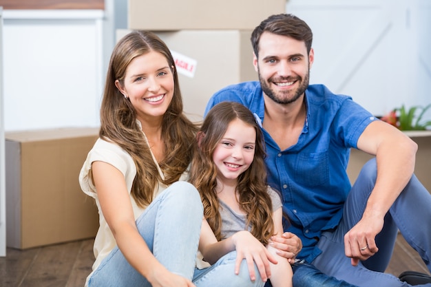 Portrait of family sitting on floor