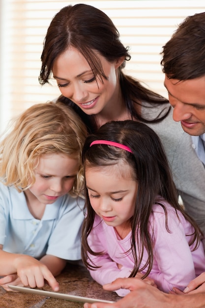 Portrait of a family using a tablet computer together