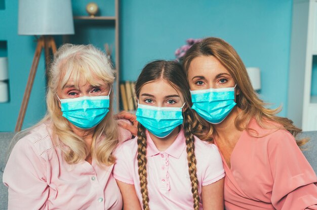 Photo portrait of family wearing mask at home