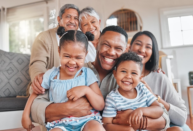 Photo portrait of a family with their grandparents bonding together on the couch at home