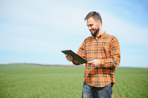 portrait of farmer standing in field