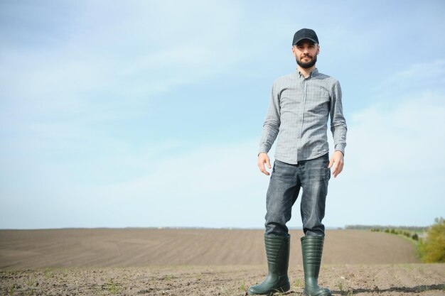 Portrait of farmer standing in field