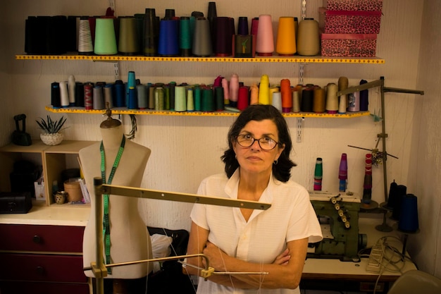 Portrait of fashion designer standing at studio