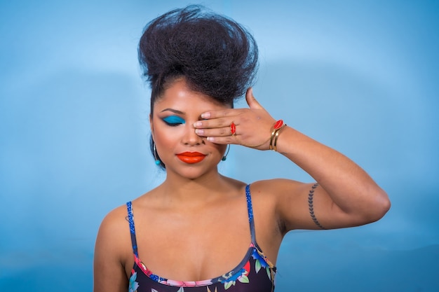 Portrait of fashion rocker style woman with bright makeup wearing a leather jacket