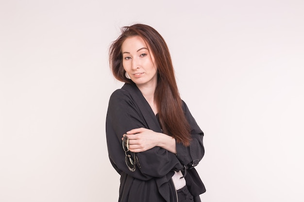 Portrait of fashionable beautiful asian woman in black over white